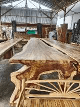 8-meter long massive solid wood bar table with dramatic natural grain and live edge.