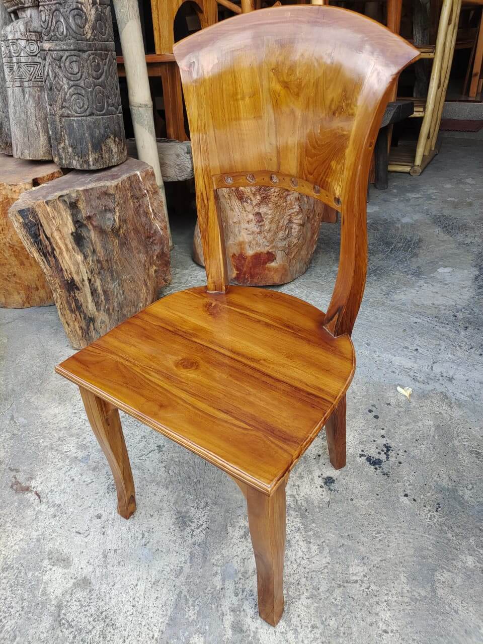Chairs C solid teak wood with a high backrest and a polished glossy finish.