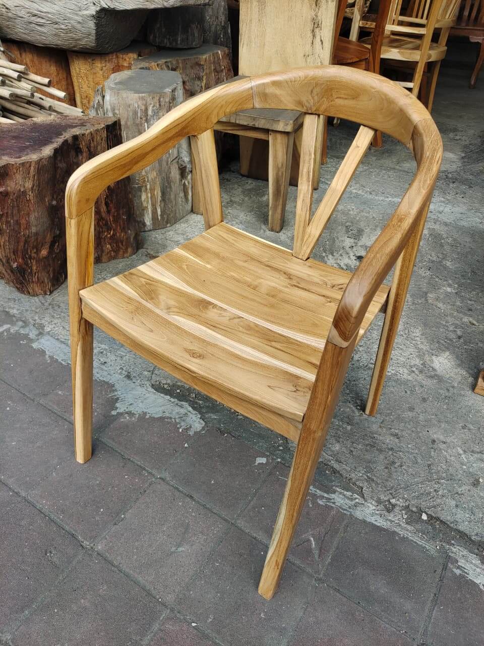 Chairs E solid wood featuring a unique high backrest with a vertical slit and dark brown finish.
