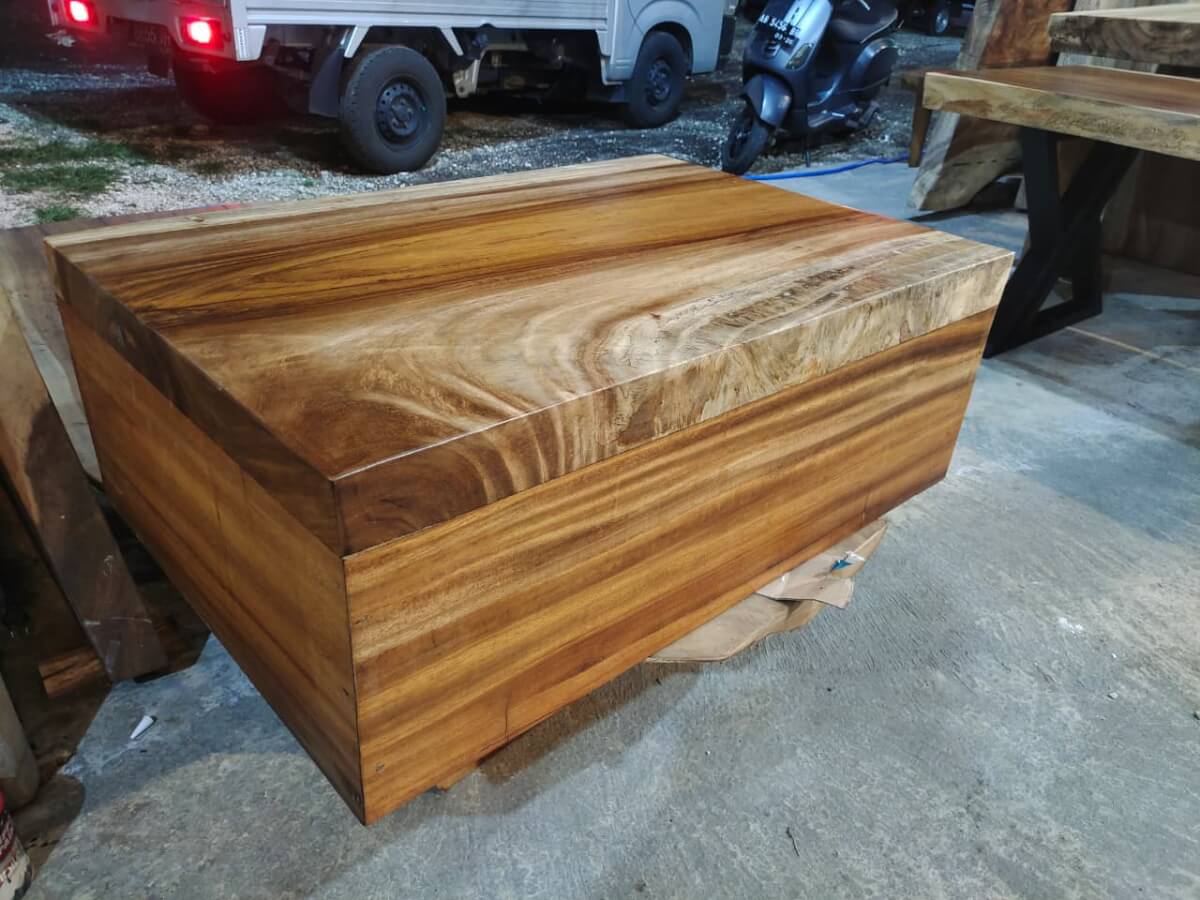 Massive solid wood block coffee table featuring high-contrast natural wood grain patterns.