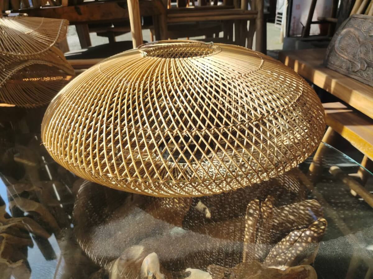 It is dome-shaped with an open cross pattern and displays artistic light shadows.