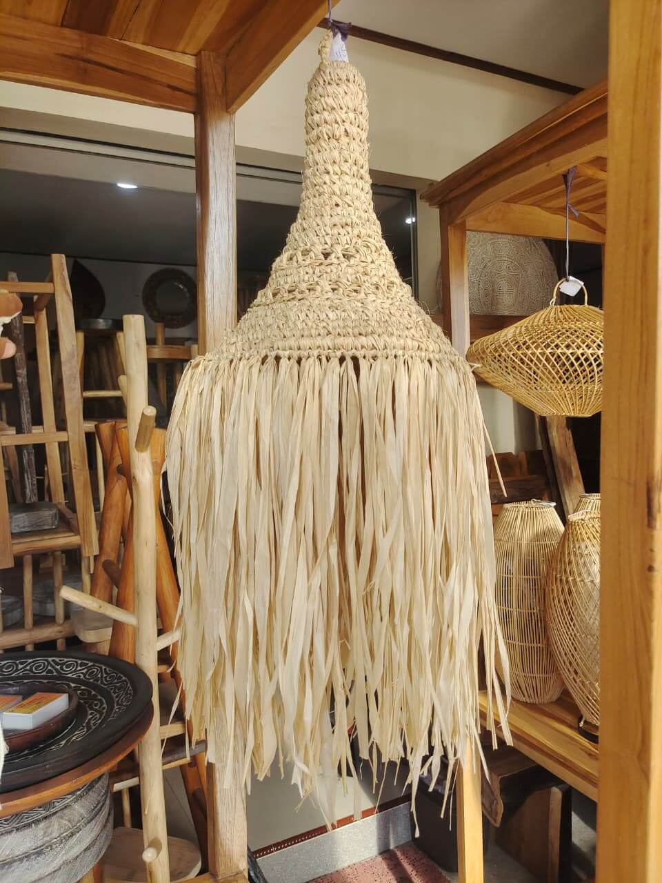 Handmade pendant lamp made from natural fiber with cone design and long tassels