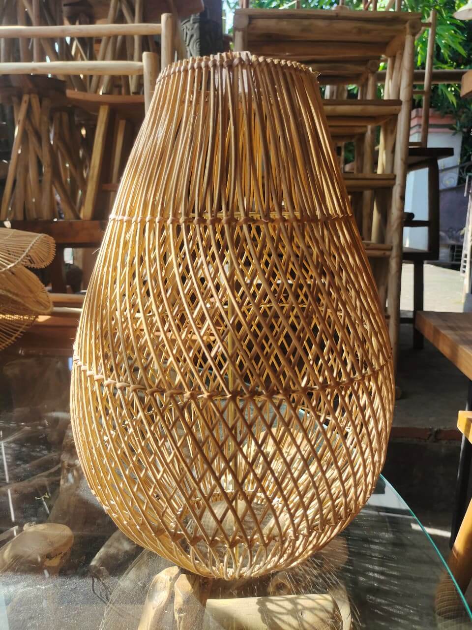 Handmade rattan lampshade in the shape of a water drop with vertical and diagonal weaves