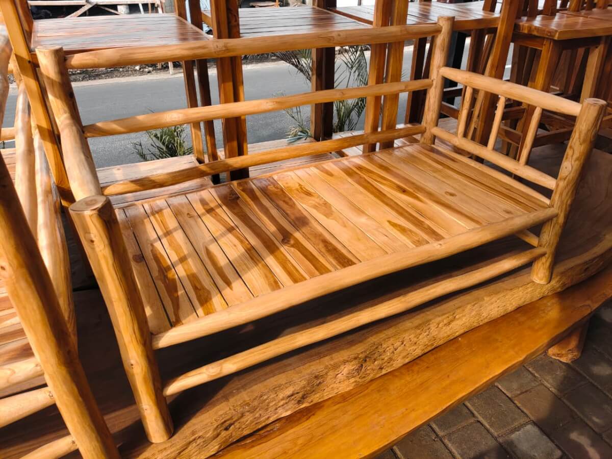 Sofa A solid wood frame with a natural round timber design and spacious seat.