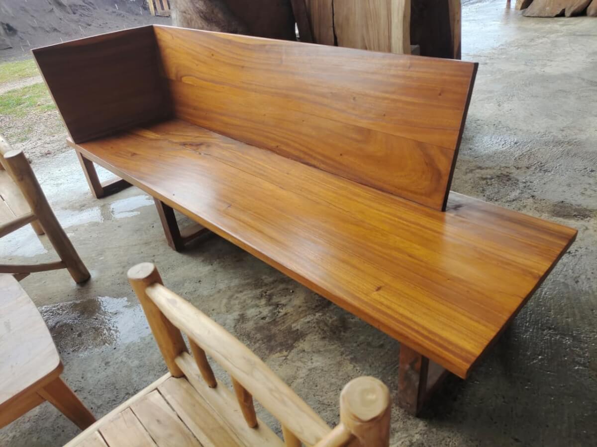 Sofa D solid wood featuring an asymmetric minimalist design with smooth wooden plank.