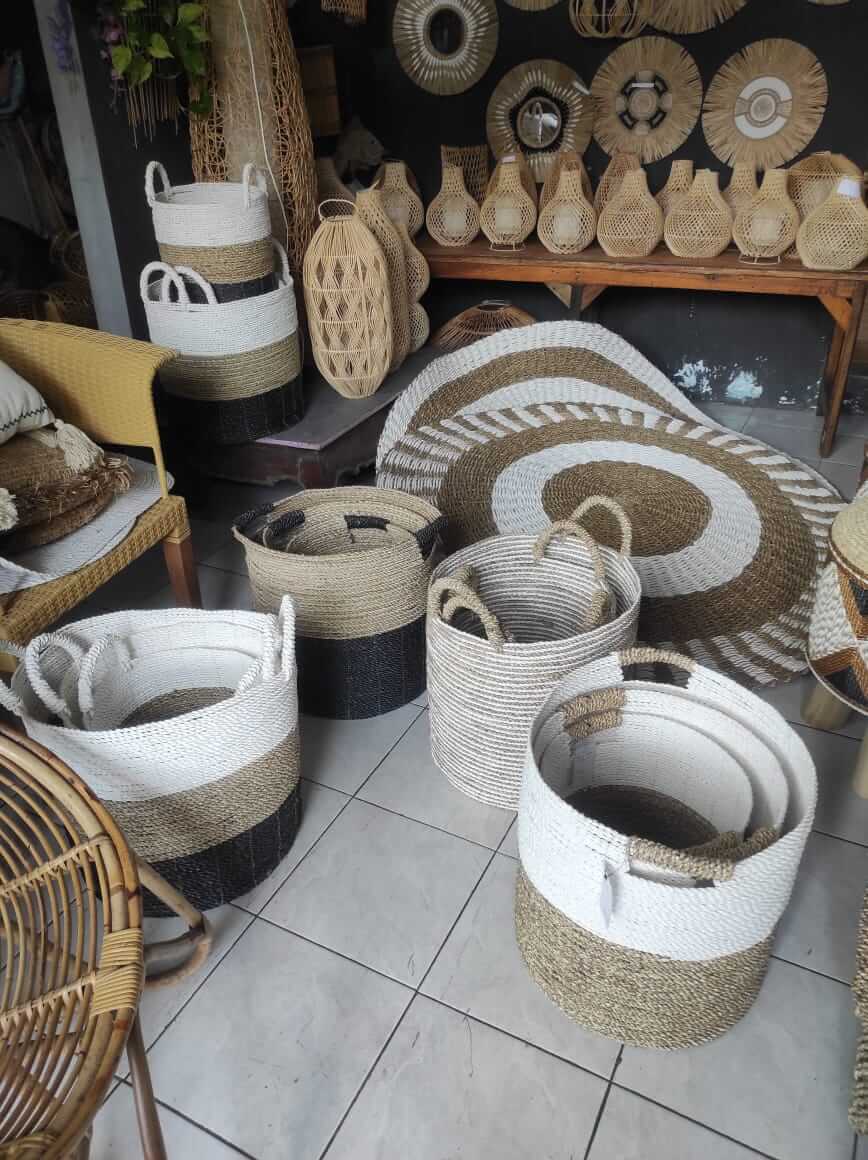 Handmade natural fiber woven basket with neutral color and handle